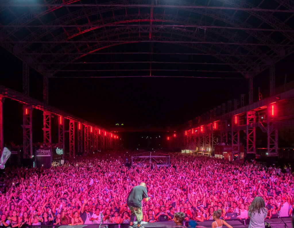 Sean Paul before a huge crowd lit in pink during his live performance in Milan, Italy, at Kozel Carroponte