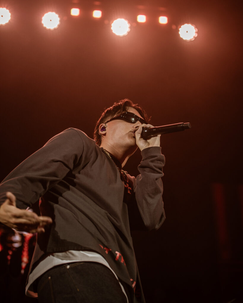 Kid Yugi with mic on red orange lights